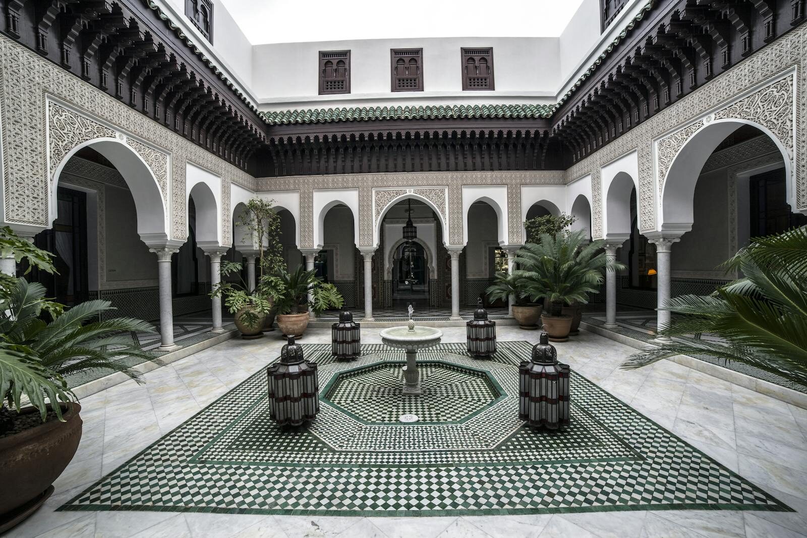 Explore this serene and intricately designed Moroccan courtyard in Marrakech.
