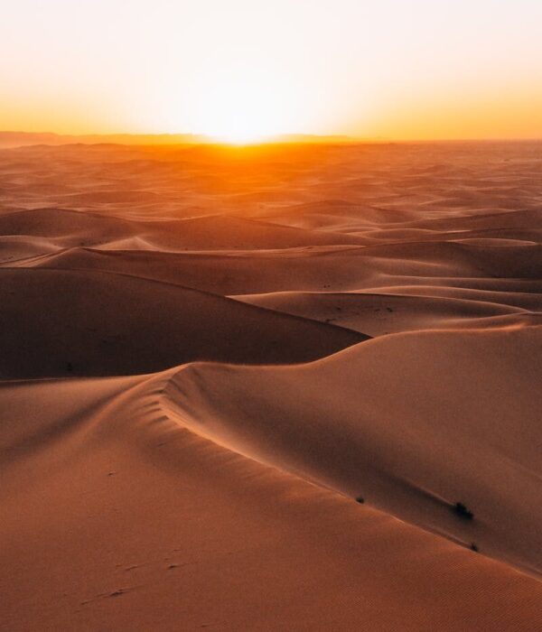 Majestic sunrise over the dunes of the Sahara Desert in Morocco.