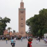 A vibrant scene near Koutoubia Mosque in Marrakesh, capturing local culture and architecture.