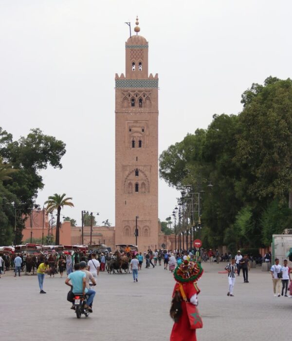 A vibrant scene near Koutoubia Mosque in Marrakesh, capturing local culture and architecture.